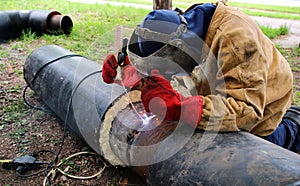 Welder Working on Metal Tubes