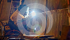 A welder working at shipyard