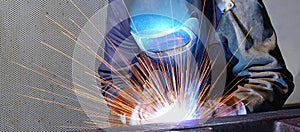 Welder works in an industrial company - production of steel comp photo