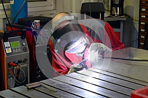 Welder works in the metall industry