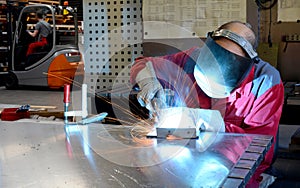 Welder works in the metall industry - portrait