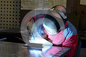 Welder works in the metall industry - portrait