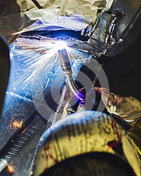 Welder works on a vehicle