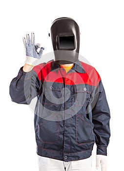 Welder in workwear suit.