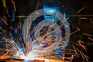 Welders team welding automotive part