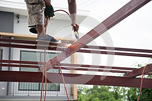 Welders welding metal, Welding