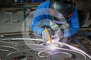 Welders are welding the various parts.