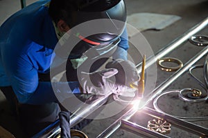 Welders are welding the various parts.