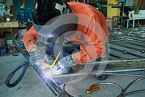 Welders are welding the various parts.