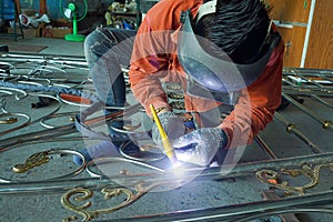 Welders are welding the various parts.