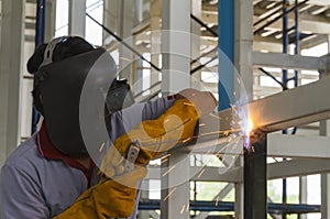 Welders were welding steel structural by arc welding.