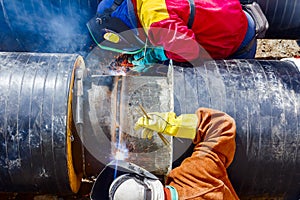 Welders working on a pipeline.