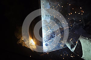 Welding arc. The process of welding products and metal. Sparks fly