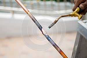 Welding of copper pipe of a methane gas pipeline or of a conditioning or water system. Welding soldering copper pipes.
