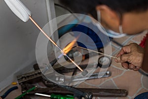 Welding of copper pipe of a methane gas pipeline or of a conditioning or water system. Welding soldering copper pipes. Gas Welding
