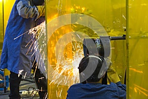 The welding craftsman grinding the steel tube