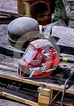 Welding helmet on a wood pallet