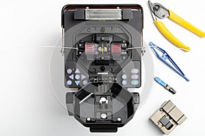 Welding machine and tool kit for stripping and welding of optical fiber