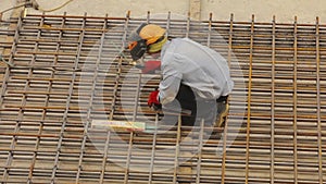 Welding metal construction. A welder welds a metal structure. Construction welder