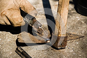 Welding old broken hoe with electrocautery