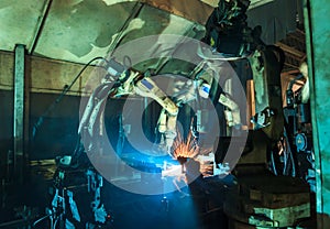 Welding robots machine movement in a car factory