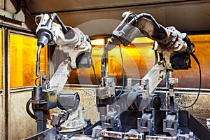 Welding robots movement in a car factory