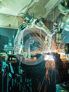 Welding robots movement in a car factory