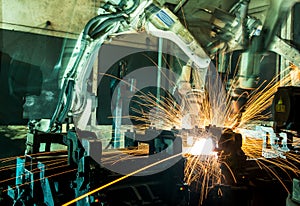 Welding robots movement in a car factory