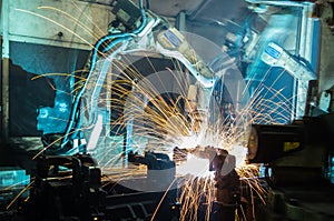 Welding robots movement in a car factory