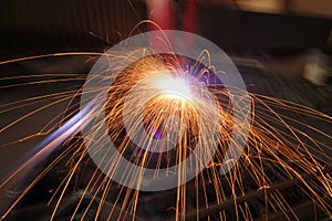 Welding with sparks in the factory.