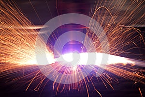 Welding with sparks in the factory.