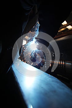 Welding with sparks in the factory.