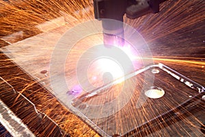 Welding with sparks in the factory.