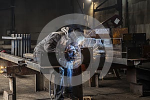 Welding with sparks by Process fluxed cored arc welding ,Industrial steel welder part in factory welder Industrial