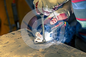 Welding the stainless steel stud to the flange