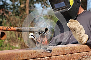 Welding steel that produces smoke and sparks