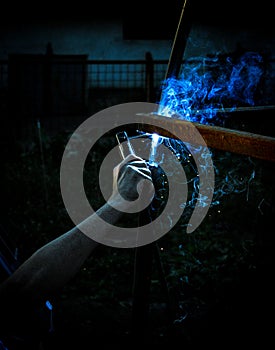 Welding steel structures and bright sparks with lens flare