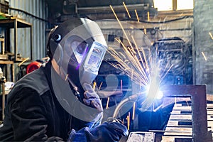 Welding work in an electromechanical workshop at a mechanical assembly site