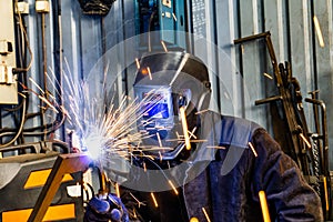 Welding work in an electromechanical workshop at a mechanical assembly site