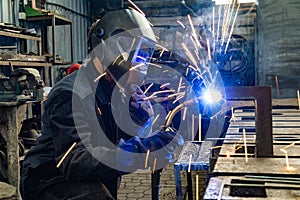 Welding work in an electromechanical workshop at a mechanical assembly site