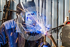 Welding work in an electromechanical workshop at a mechanical assembly site