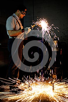 Welding worker in factory