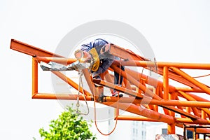 The welding workers at structures site. Worker is welding steel structures