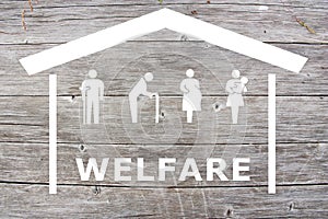 Welfare concept on wooden background