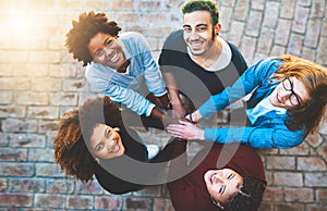 Well achieve our dreams together. High angle portrait of a diverse group of college friends standing outside with their