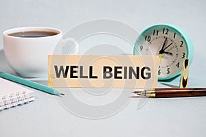 Well-Being wooden sign with a beach on background