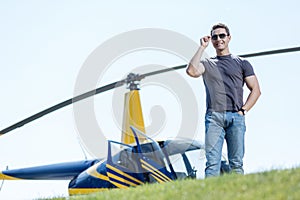 Well-built air policeman posing at a helipad