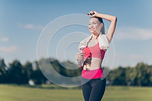 Well done! Attractive young sportwoman finished her work out and