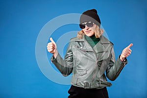 Well done, good job. Waist up portrait of joyful brunette woman showing thumbs up, like gesture to camera and smiling broadly,