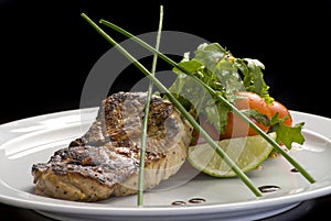 Well-done steak with suace and vagetables. Food photo for restaurant menu